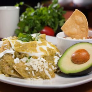 Chilaquiles - Eggs scrambled with tortillas, onions, peppers and green sauce